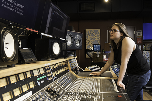 A student working at an audio board.